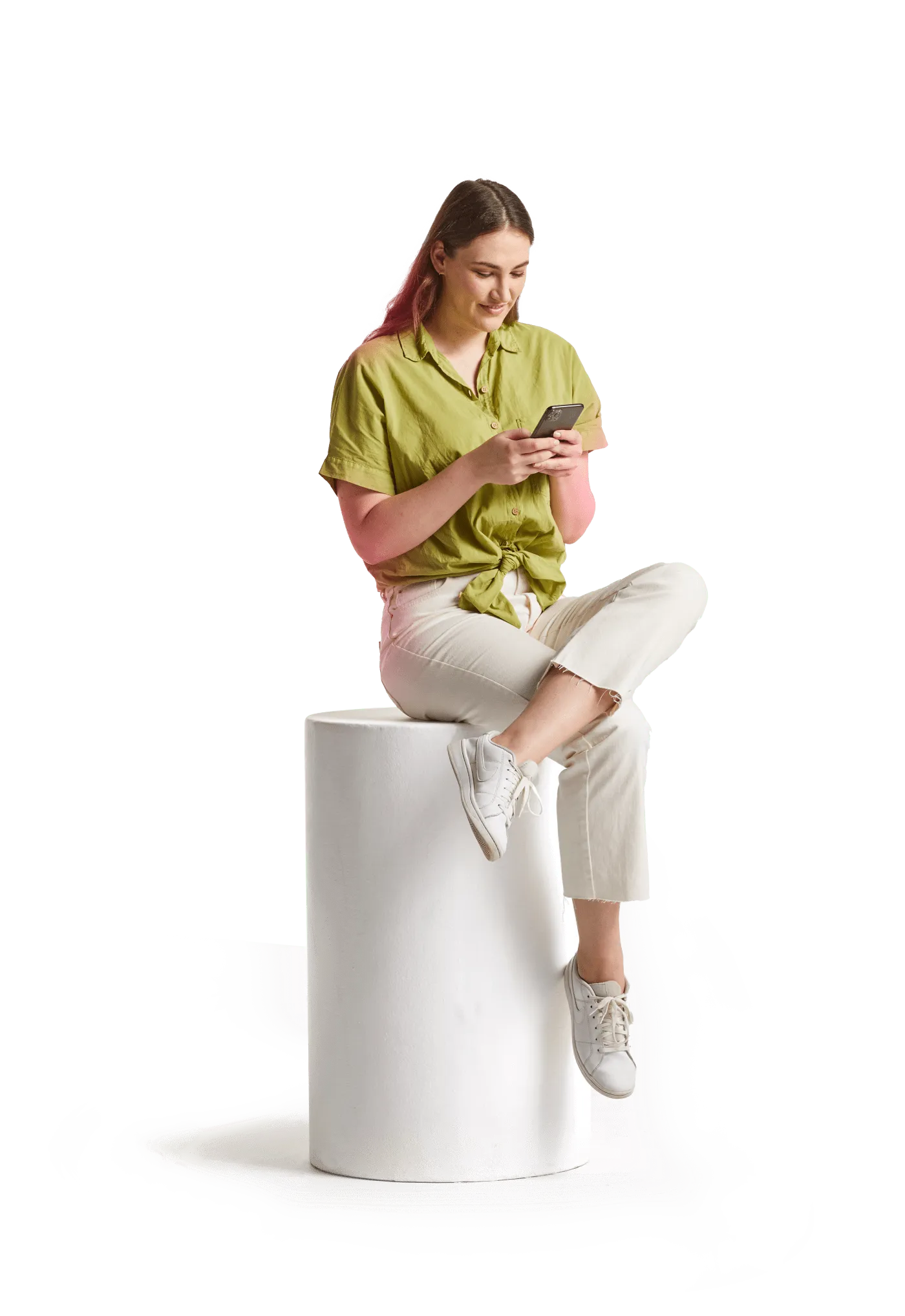 Image of a woman sitting typing on her phone